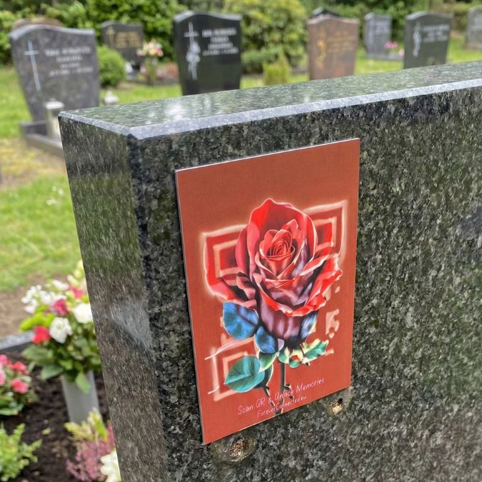Single red rose QR memorial plaque mounted on gravestone — beautiful remembrance plaque that opens a digital memorial page