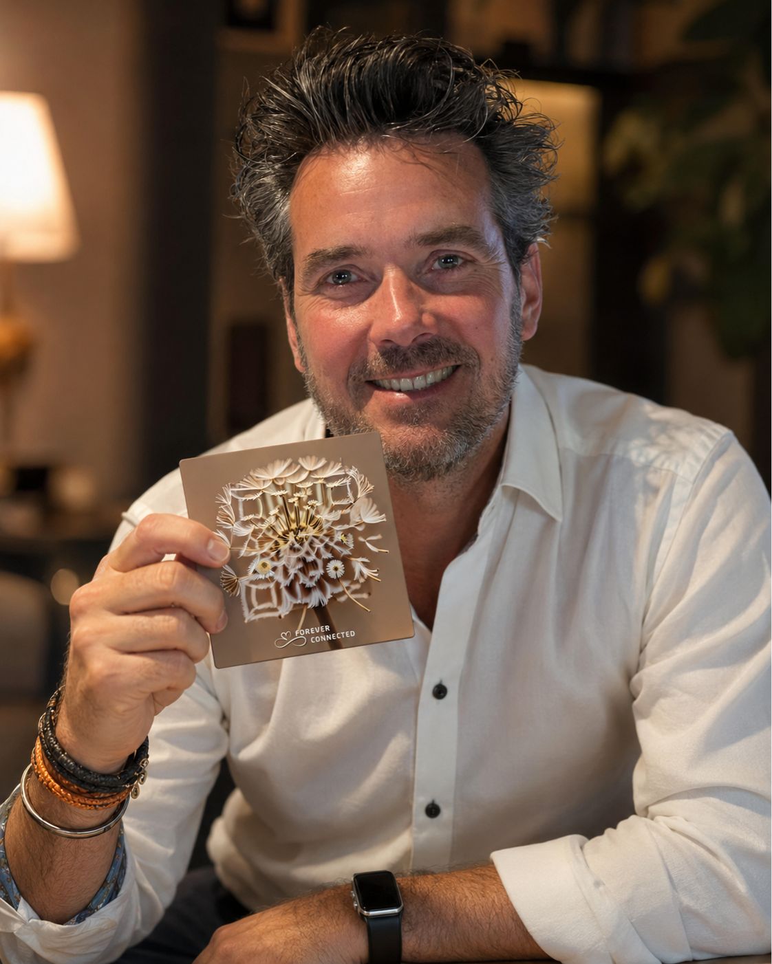 Frederik Rademakers, founder and CEO of Forever Connected, holds a memorial plaque with an artistic Dandelion that scans like a QR code