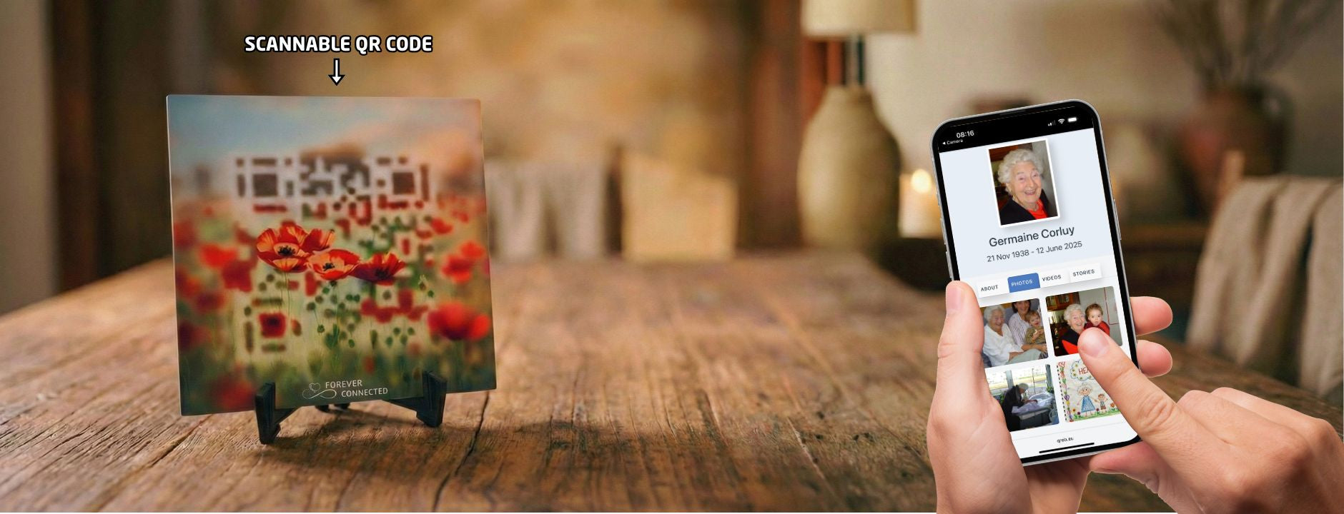 A  ceramic tile resting on a black stand, featuring red poppies with an embedded QR code that leads to a  digital memorial website.