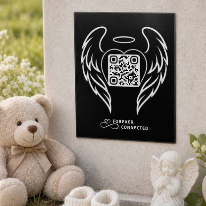 Forever Connected QR memorial plaque with angel wings an angel baby, shown with teddy bear, baby shoes and a digital memorial connection