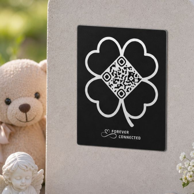 Forever Connected clover QR remembrance plaque for an angel baby, placed on a memorial stone and linked to a digital page with meaningful memories