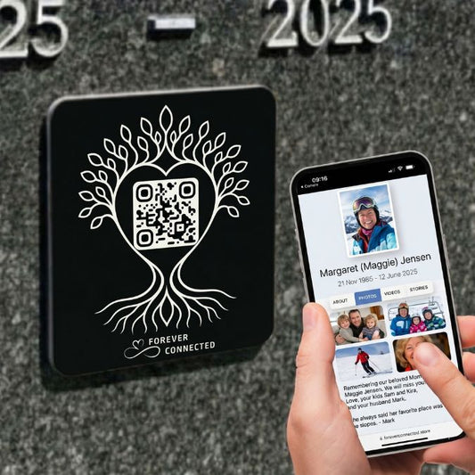 Forever Connected black tree of life QR memorial plaque attached to a granite headstone, helping keep memories alive through an easy-to-create digital remembrance page