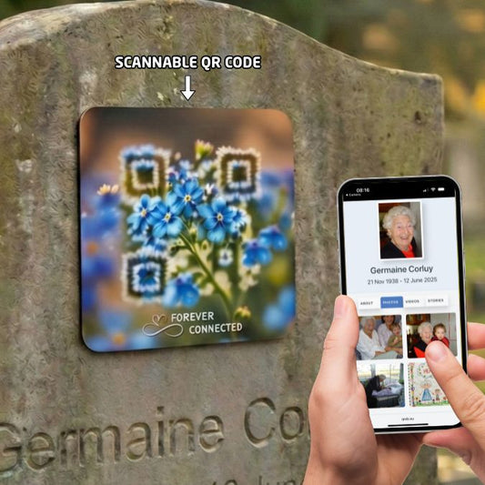 Scannable QR code on a stone plaque with a phone scanning it, displaying a profile.