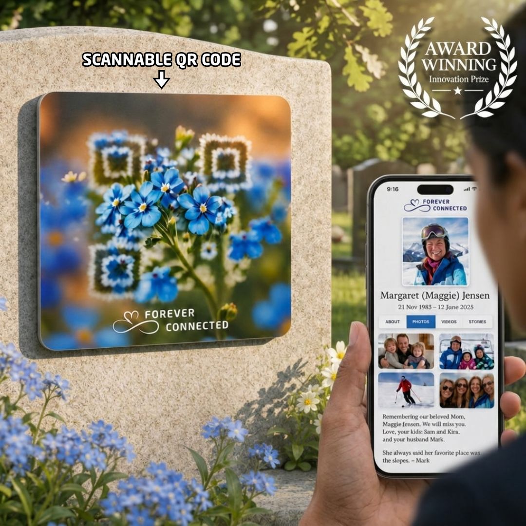 A square memorial plaque featuring a QR code artfully integrated into a blue forget-me-not floral design with the text "Forever Connected" at the bottom. The QR Plaque is attached to a stone headstone, with a hand in the foreground holding a smartphone displaying the deceased's digital profile page.
