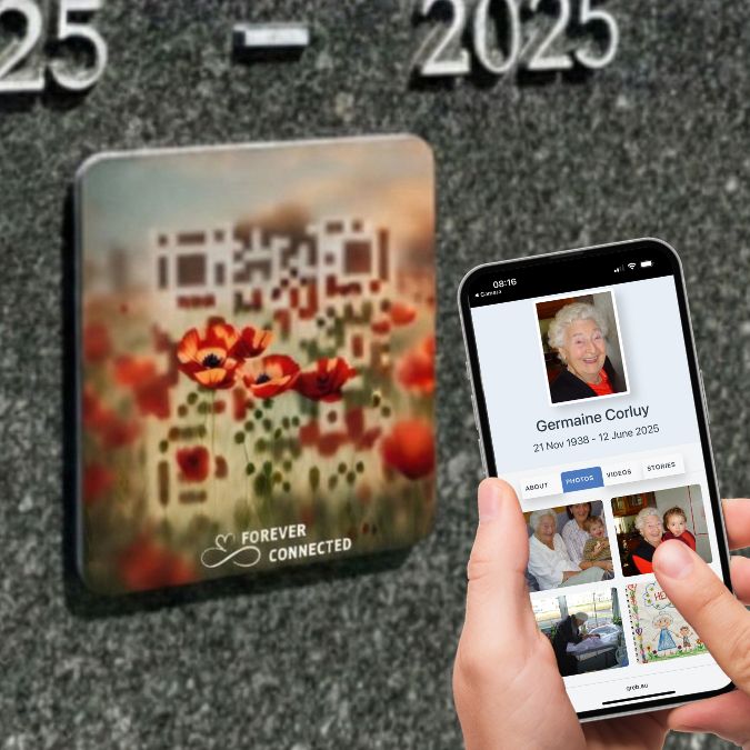 Scannable poppy QR memorial plaque on a grave, linking from the physical remembrance object to a digital memorial page on a smartphone.