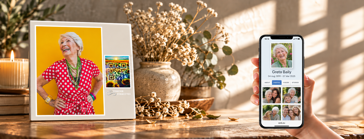 Memorial photo plaque with sunflowers and sunset QR design beside a smartphone showing a Forever Connected remembrance page. A unique digital memorial object helping families honor loved ones and keep memories alive online.A modern grief support object to preserve memories of a loved one.