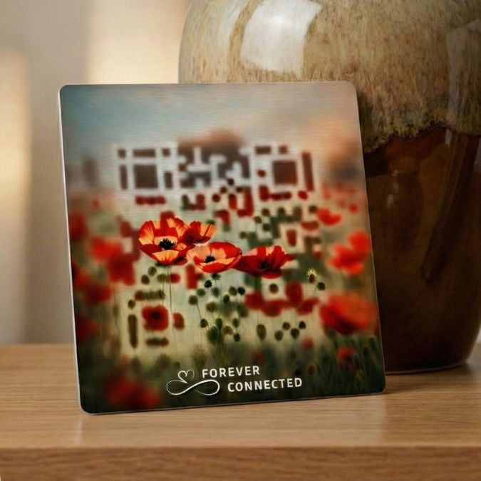 Forever Connected Red Poppies QR medallion beside an urn and framed portrait, linking to a digital memorial page for sharing memories at home.